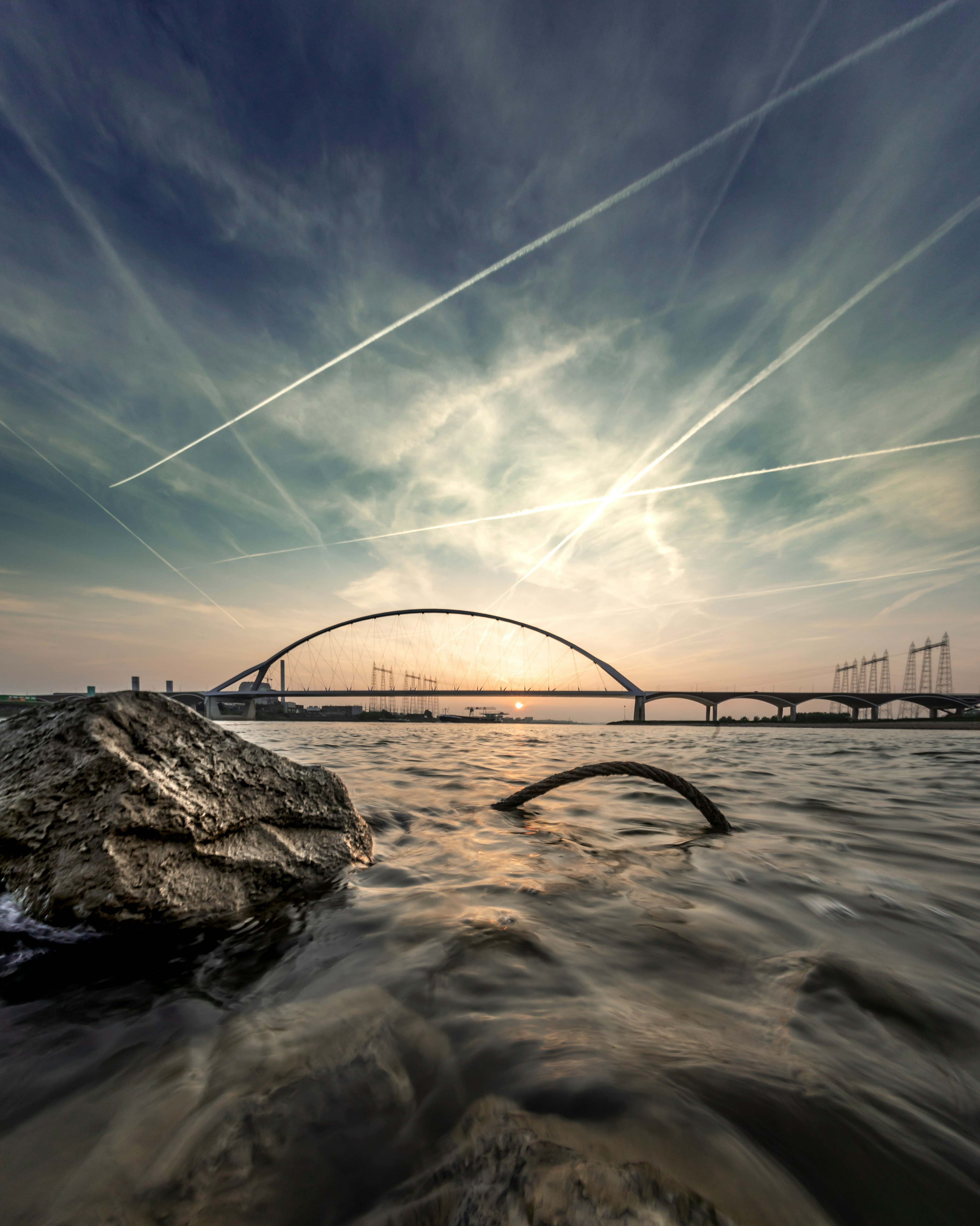 timelapse photography of rock and bridge